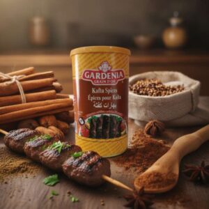 Bote de Especias para Kafta (Kafta Spices) Gardenia Grain D'Or, con imagen de pinchos de Kafta a la parrilla, rodeado de canela y nuez moscada.