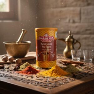 Bote de Siete Especias (Seven Spices) Gardenia Grain D'Or de 454g, mezcla libanesa con mortero en la etiqueta y especias en polvo alrededor.