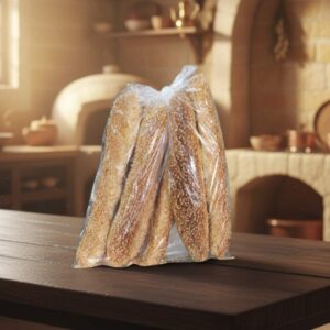 El auténtico Kaak (o Kaa'k), un pan o galleta alargada y crujiente, cubierta generosamente con semillas de sésamo (ajonjolí). Es el snack libanés perfecto para llevar, mojar en té, o acompañar con queso y zaatar.