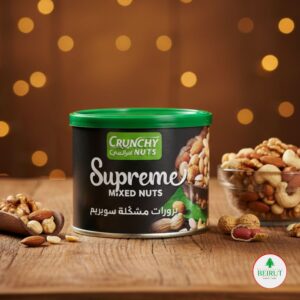 Envase cilíndrico de la marca Crunchy Nuts con tapa verde, etiquetado como Supreme Mixed Nuts (Frutos Secos Supremos). El envase muestra una mezcla de frutos secos premium como almendras, nueces de la india y nueces.