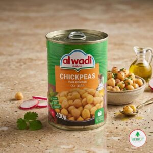 Lata de Garbanzos Al Wadi Al Akhdar de 400g sobre una mesa de mármol, acompañada de un bowl con garbanzos preparados.